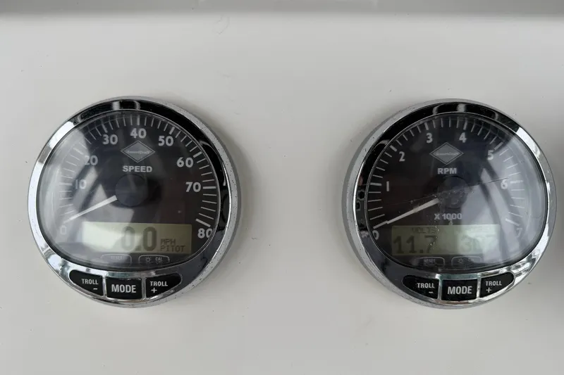 Slide: The Image of Boat dashboard with speedometer and RPM gauge, HBI model 22, year 2006. - 14