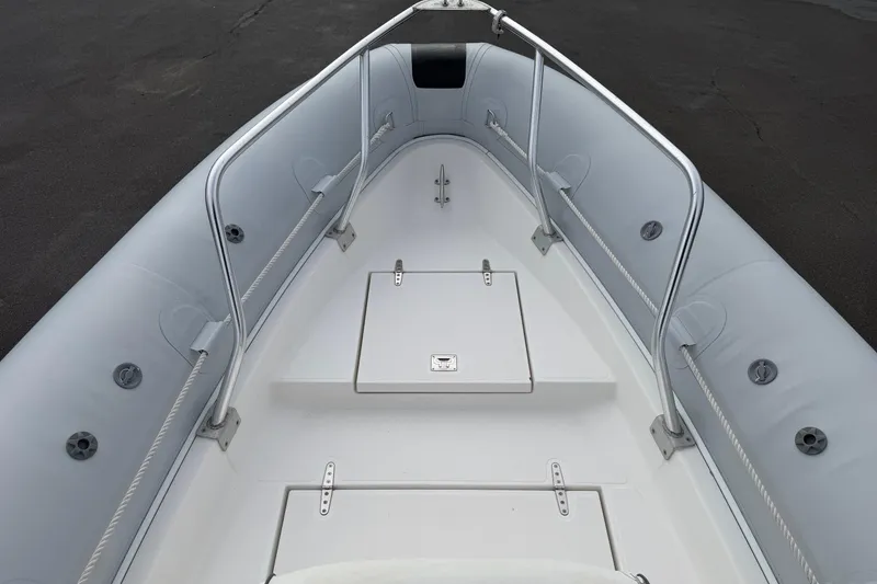 Slide: The Image of 2006 HBI 22 boat interior with sleek design and storage compartments. - 5
