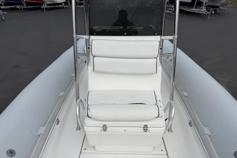 Slide: The Image of 2006 HBI 22 boat with white seating and stainless steel frame. - 7