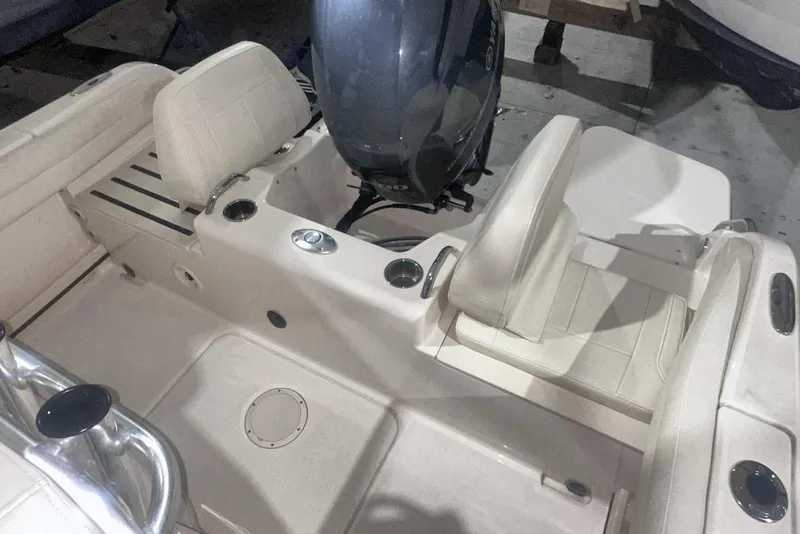 Slide: The Image of 2021 Grady-White Fisherman 216 boat interior with seating and motor. - 11