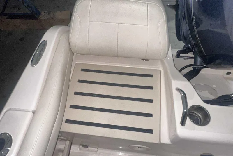 Slide: The Image of 2021 Grady-White Fisherman 216 boat seat and deck detail with cup holder. - 13
