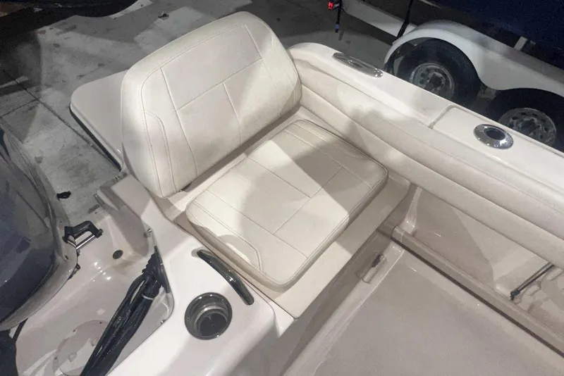 Slide: The Image of 2021 Grady-White Fisherman 216 boat seat with cup holders and storage. - 14