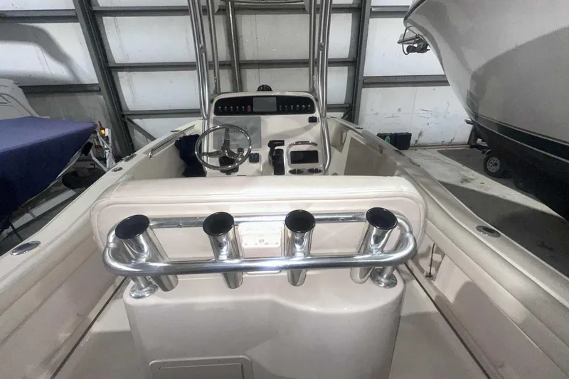 Slide: The Image of 2021 Grady-White Fisherman 216 boat interior with steering console and rod holders. - 16