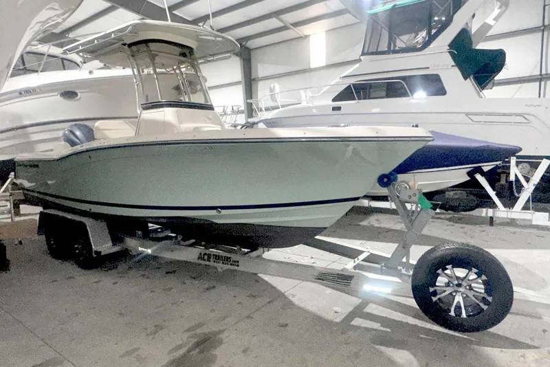 Slide: The Image of 2021 Grady-White Fisherman 216 boat on trailer in indoor storage facility. - 2