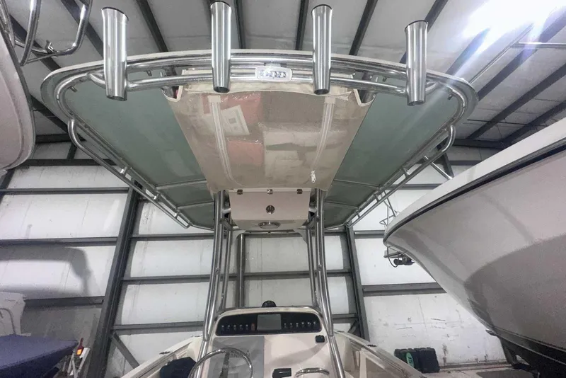 Slide: The Image of 2021 Grady-White Fisherman 216 boat with T-top and rod holders in storage. - 20