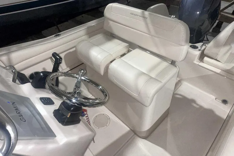 Slide: The Image of 2021 Grady-White Fisherman 216 boat interior with steering wheel and Garmin system. - 23