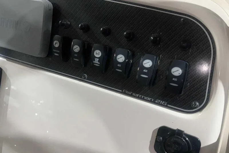 Slide: The Image of Control panel of 2021 Grady-White Fisherman 216 boat with labeled switches. - 25