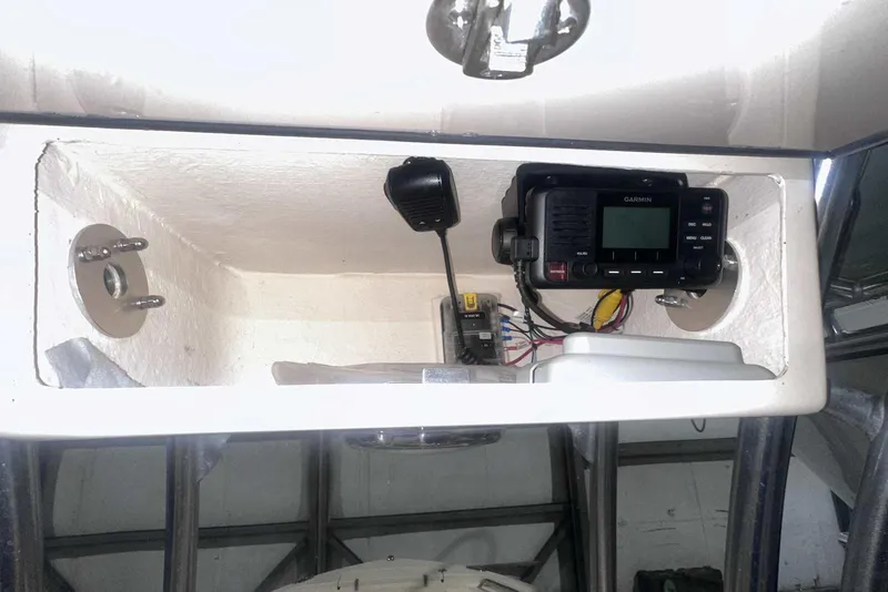 Slide: The Image of 2021 Grady-White Fisherman 216 console with Garmin marine radio and microphone. - 27