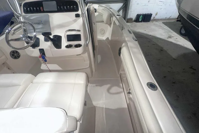 Slide: The Image of 2021 Grady-White Fisherman 216 boat interior with steering wheel and control panel. - 28