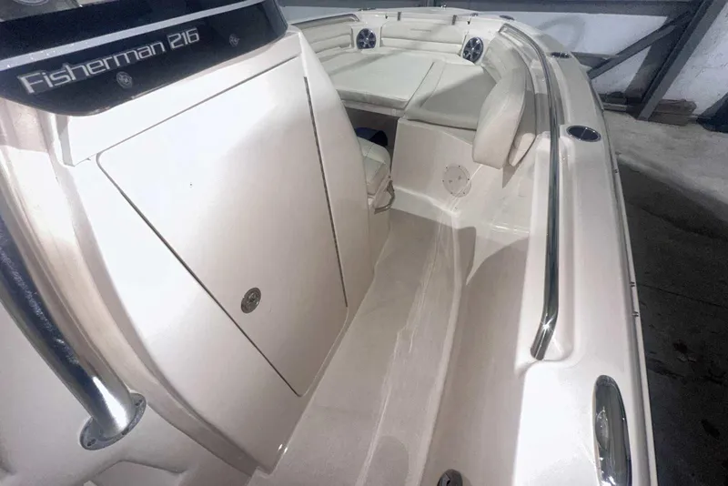 Slide: The Image of 2021 Grady-White Fisherman 216 boat interior with seating and storage compartments. - 29