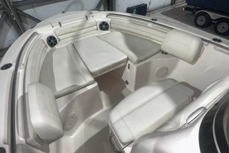 Slide: The Image of 2021 Grady-White Fisherman 216 boat interior with cushioned seating and speakers. - 34