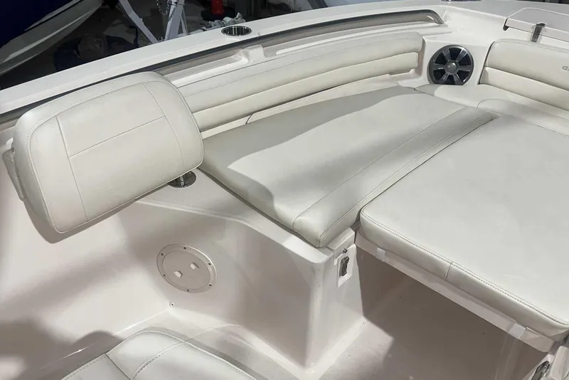 Slide: The Image of 2021 Grady-White Fisherman 216 boat interior with cushioned seating and speaker. - 38
