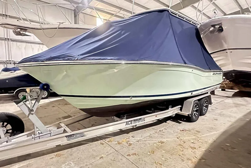 Slide: The Image of 2021 Grady-White Fisherman 216 boat on trailer, covered, in indoor storage. - 4