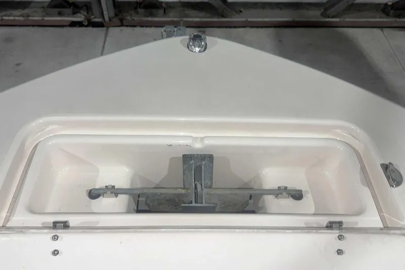 Slide: The Image of 2021 Grady-White Fisherman 216 anchor compartment, showcasing storage and design. - 40