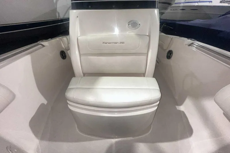 Slide: The Image of 2021 Grady-White Fisherman 216 boat interior with cushioned seating and speaker. - 41