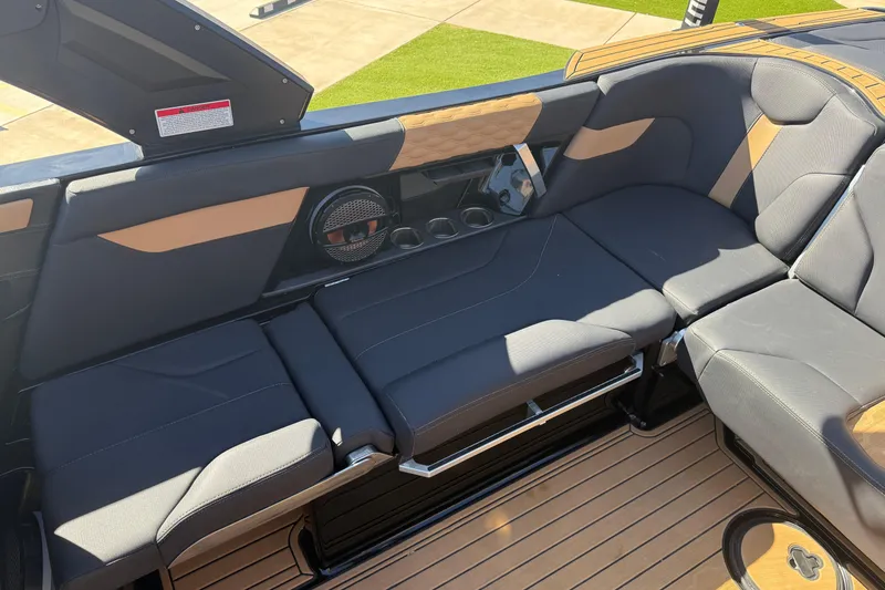 Slide: The Image of 2023 MasterCraft XT24 boat interior with luxurious seating and modern design. - 10