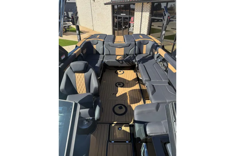 Slide: The Image of 2023 MasterCraft XT24 boat interior with luxurious seating and modern design. - 12