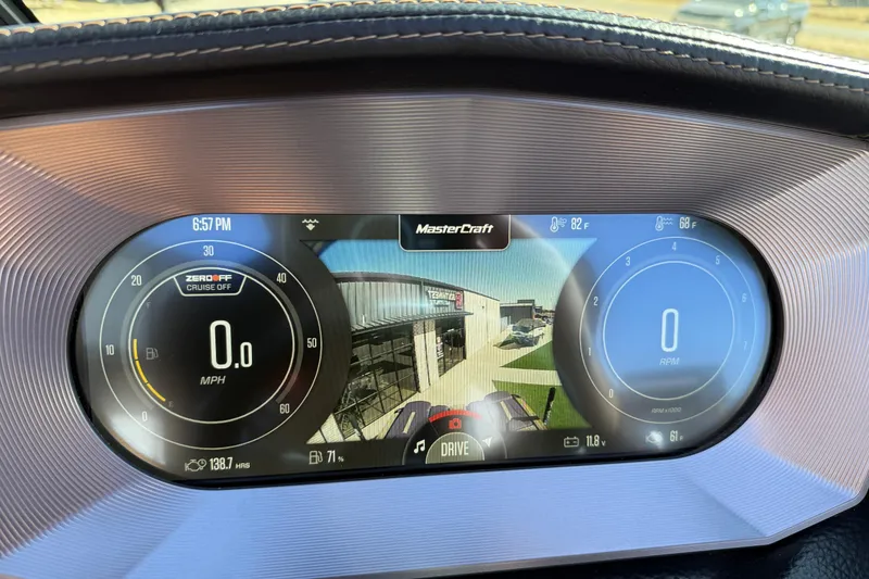Slide: The Image of 2023 MasterCraft XT24 dashboard display showing speed, RPM, and temperature readings. - 9