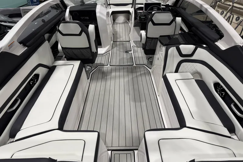 Slide: The Image of 2025 Yamaha Boats 275SE interior with sleek white seating and modern design. - 3