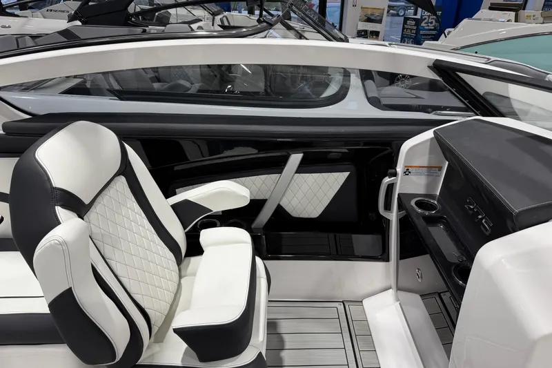 Slide: The Image of 2025 Yamaha Boats 275SE interior with luxurious seating and modern dashboard design. - 4