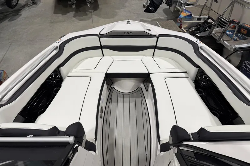 Slide: The Image of 2025 Yamaha Boats 275SE interior with sleek white seating and modern design. - 7