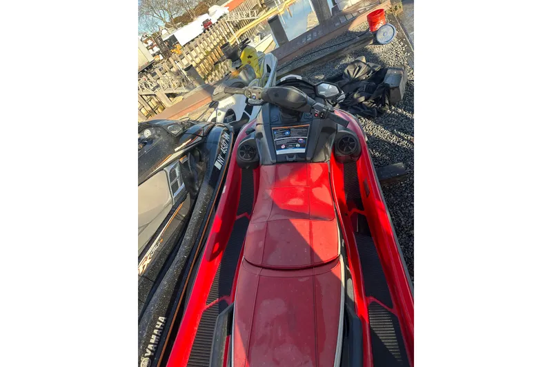 Slide: The Image of 2023 Yamaha WaveRunner VX Deluxe in red, parked outdoors. - 10