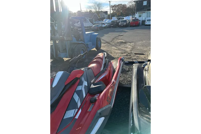 Slide: The Image of 2023 Yamaha WaveRunner VX Deluxe in a parking lot with other vehicles. - 11