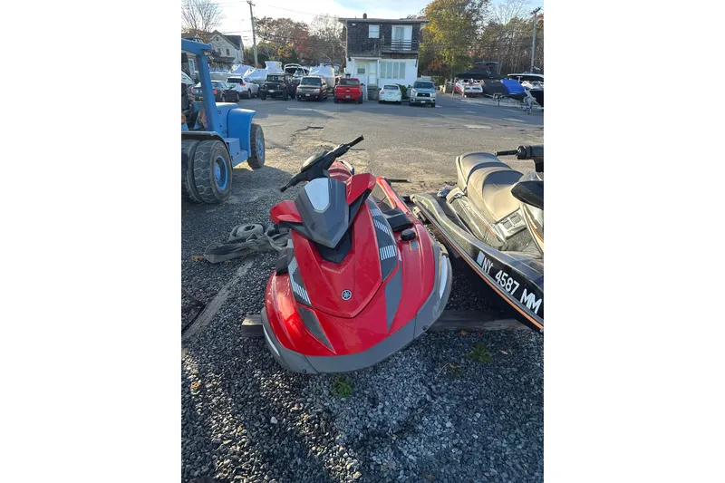 Slide: The Image of 2023 Yamaha WaveRunner VX Deluxe in a parking lot, red and gray design. - 3