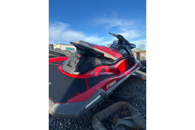 Slide: The Image of 2023 Yamaha WaveRunner VX Deluxe in vibrant red on gravel surface. - 8