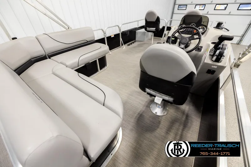 Slide: The Image of 2024 Lowe Ultra 162 Fish & Cruise pontoon boat interior with seating and helm. - 12