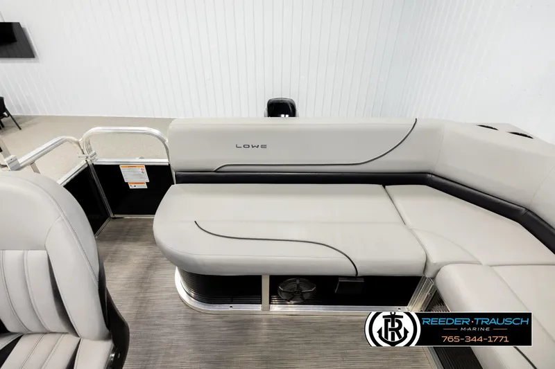 Slide: The Image of 2024 Lowe Ultra 162 Fish & Cruise boat interior with gray seating and sleek design. - 15