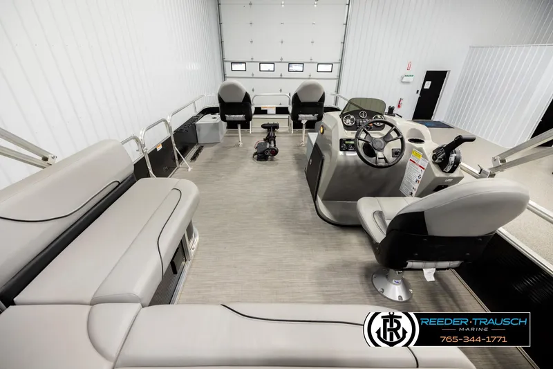 Slide: The Image of 2024 Lowe Ultra 162 Fish & Cruise boat interior with seating and steering console. - 16