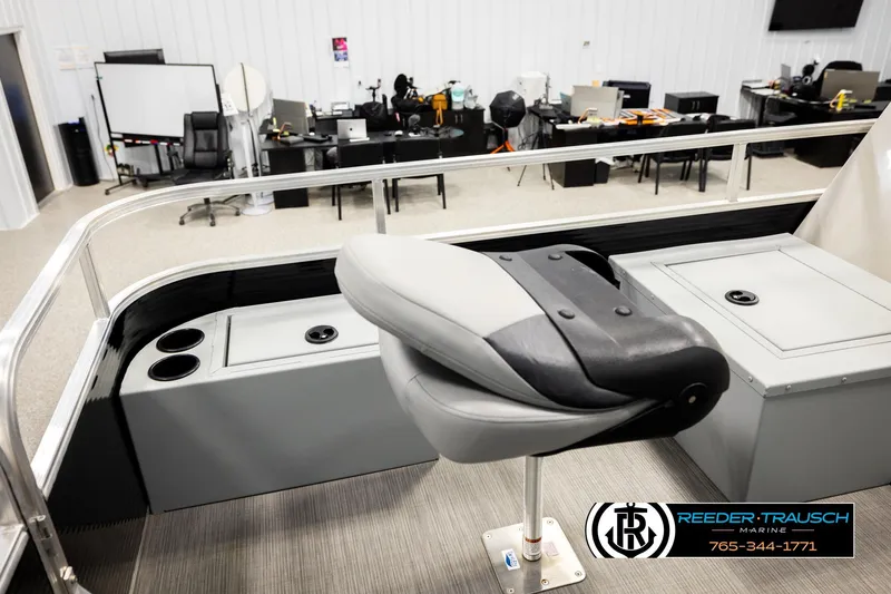 Slide: The Image of 2024 Lowe Ultra 162 Fish & Cruise boat interior with seating and storage compartments. - 21