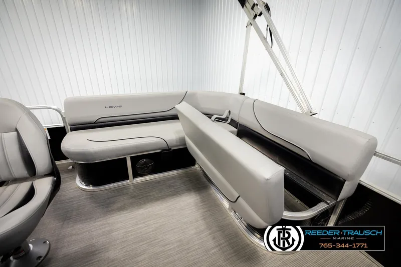 Slide: The Image of 2024 Lowe Ultra 162 Fish & Cruise boat interior with gray seating and modern design. - 27