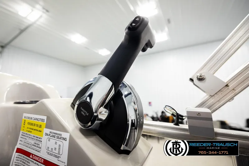Slide: The Image of Throttle control of 2024 Lowe Ultra 162 Fish & Cruise boat in showroom setting. - 33