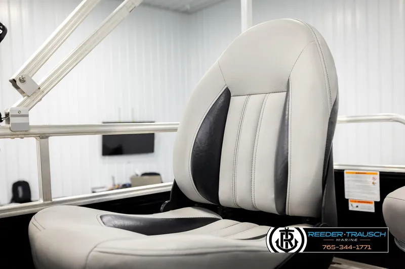 Slide: The Image of 2024 Lowe Ultra 162 Fish & Cruise boat seat in a showroom setting. - 34