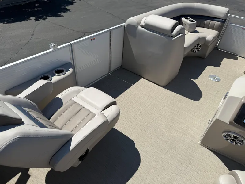 Slide: The Image of 2017 Bennington G22 boat interior with beige seating and cup holders. - 18