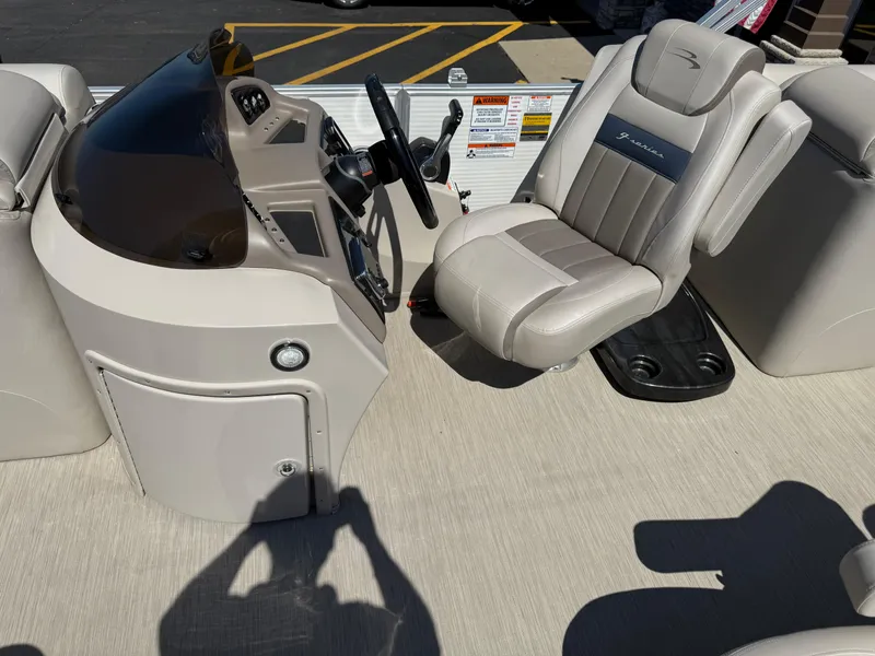 Slide: The Image of 2017 Bennington G22 boat interior with steering console and captain's chair. - 9