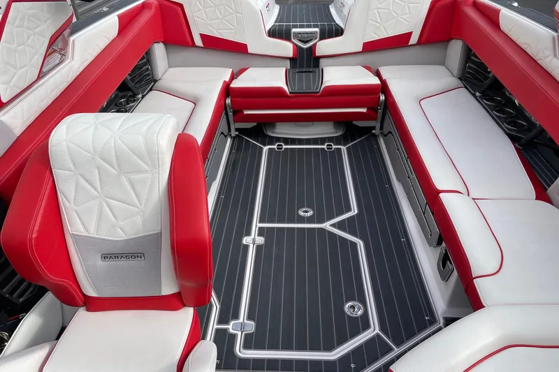 Slide: The Image of Luxurious interior of 2023 Nautique Super Air Nautique G25 Paragon with red and white seating. - 12