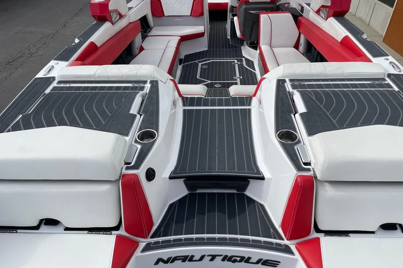 Slide: The Image of 2023 Nautique Super Air Nautique G25 Paragon interior with red and white seating. - 4