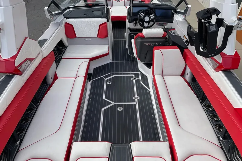 Slide: The Image of 2023 Nautique Super Air Nautique G25 Paragon interior with red and white seating. - 5