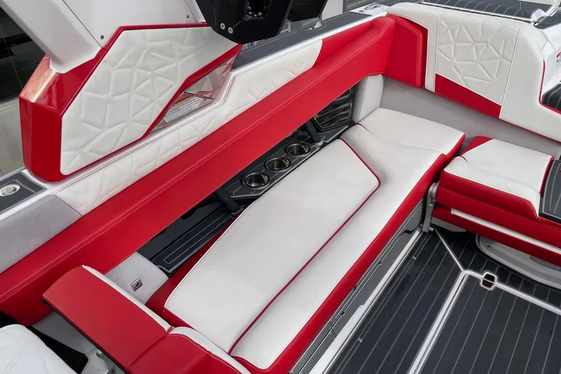 Slide: The Image of Luxurious red and white seating in 2023 Nautique Super Air Nautique G25 Paragon boat. - 7