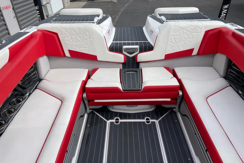 Slide: The Image of 2023 Nautique Super Air Nautique G25 Paragon interior with red and white seating. - 8