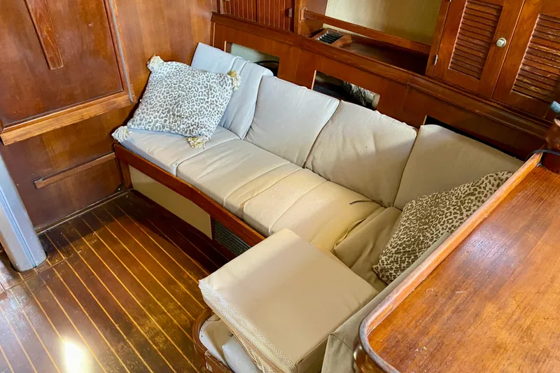 Slide: The Image of Interior of 1994 Island Packet 44 yacht with cozy seating and wooden finish. - 104