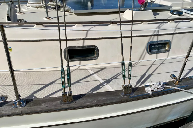 Slide: The Image of Deck view of a 1994 Island Packet 44 sailboat with rigging and ropes. - 11