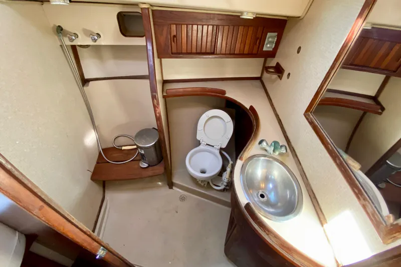 Slide: The Image of Bathroom interior of 1994 Island Packet 44 yacht with sink, toilet, and shower. - 115