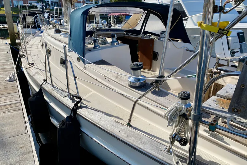 Slide: The Image of 1994 Island Packet 44 sailboat docked, showcasing deck and rigging details. - 15