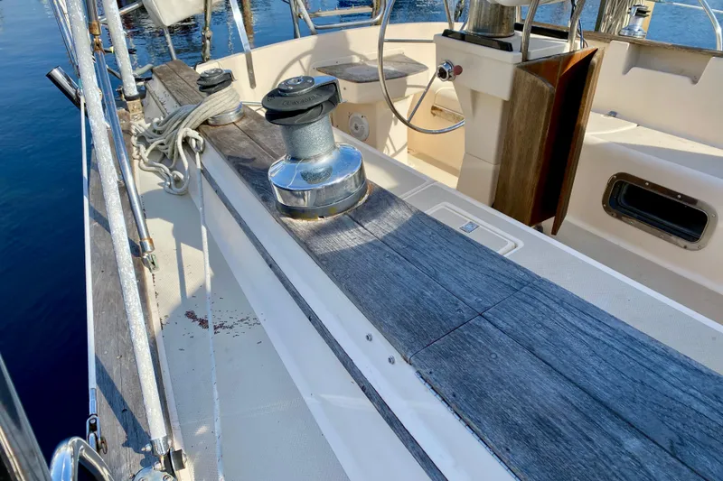 Slide: The Image of Deck view of 1994 Island Packet 44 sailboat with winch and wooden accents. - 18