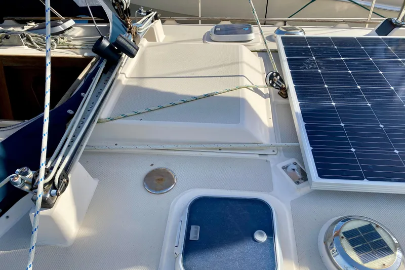 Slide: The Image of Deck of 1994 Island Packet 44 sailboat with solar panel and rigging. - 20