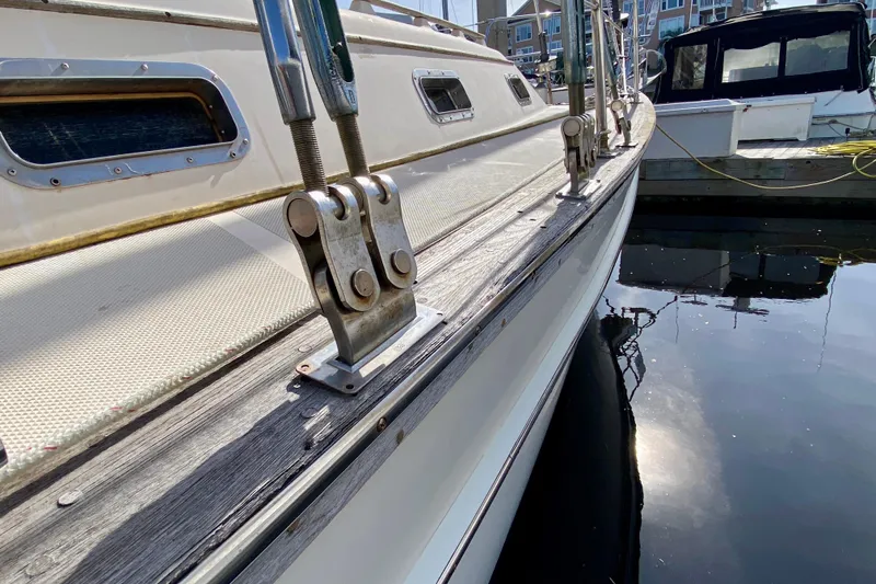 Slide: The Image of 1994 Island Packet 44 sailboat docked, showcasing deck and rigging details. - 22